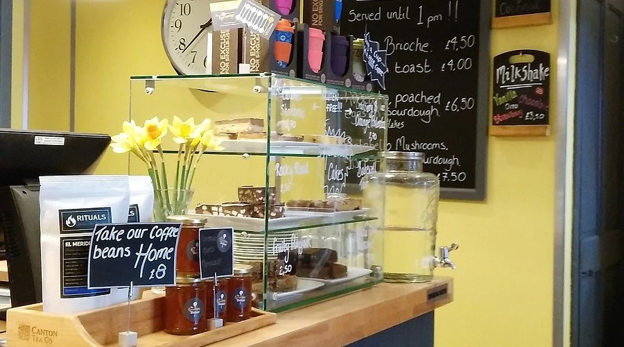 Older café counter with a handwritten menu board